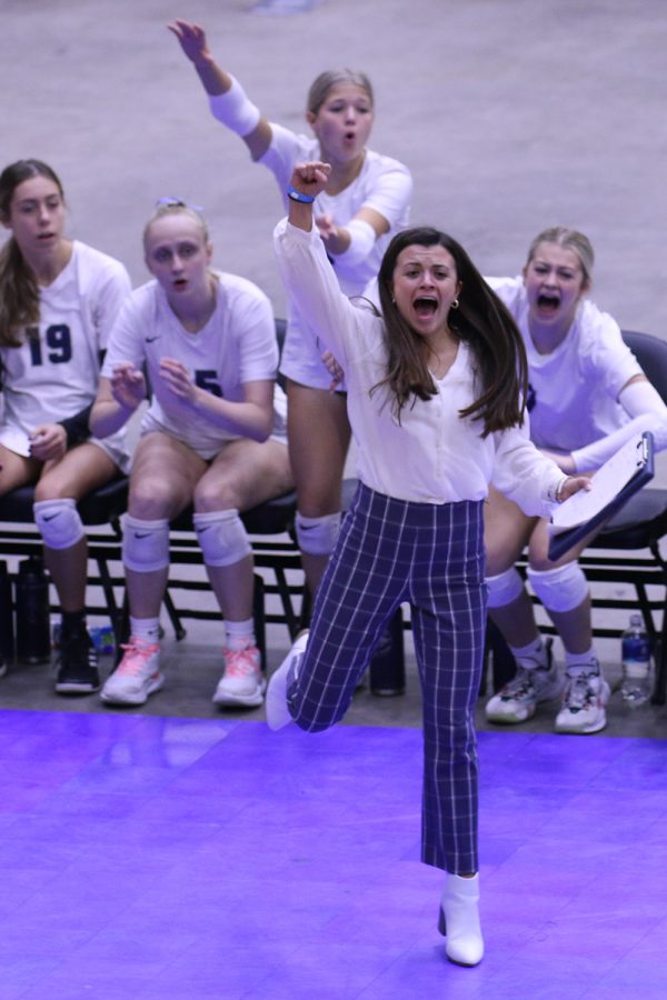 After a team block in the state match against Free State, first-year head coach Kylie Corneliusen shows her excitement for the play.