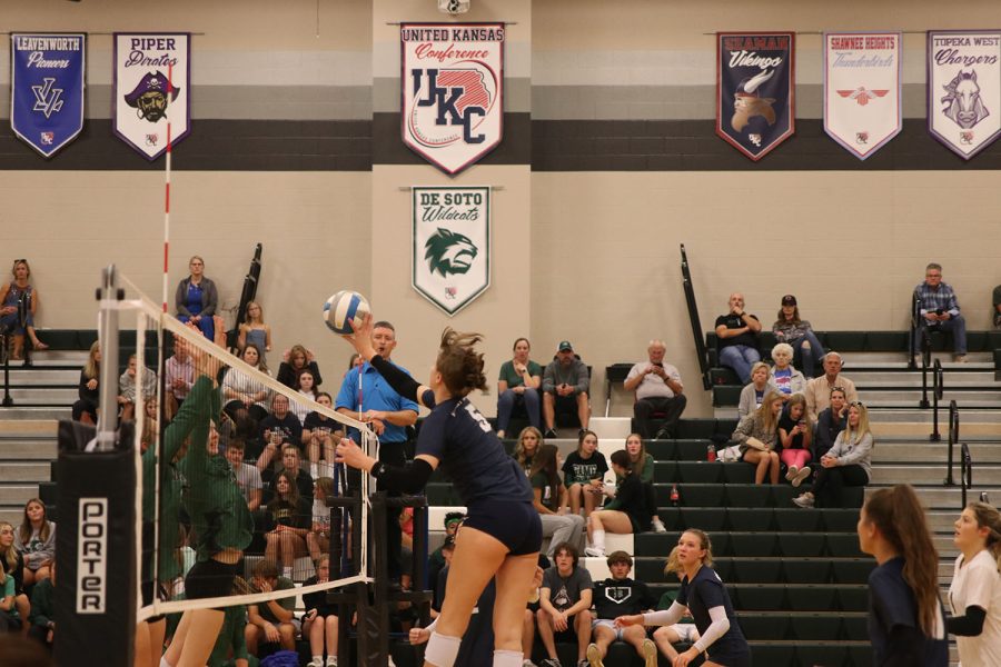 With precision, sophomore Saida Jacobs taps the ball past the blockers for the point. The Jaguars faced off against De Soto Thursday, October 13. They won the game in the first three sets. 