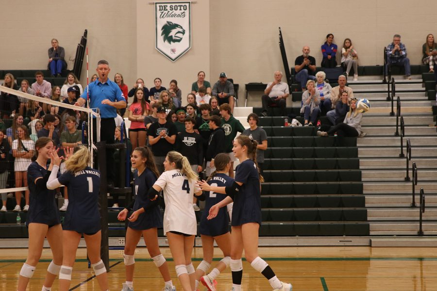 After scoring a big point, sophomore Saida Jacobs is congratulated by her teammates. 
