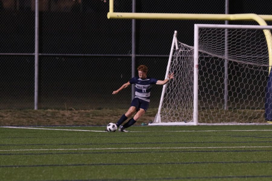 From the goal box, senior Owen Peachee kicks the ball down the field.