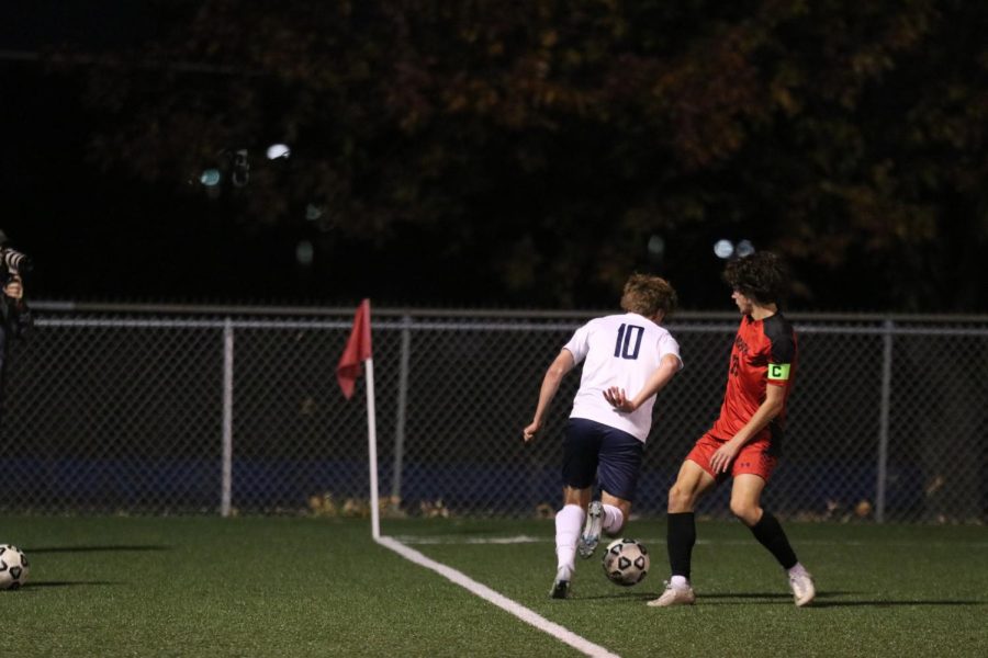 Senior Nico Pendleton dribbles past his opponent in an attempt to score a goal, Thursday, Oct. 13.