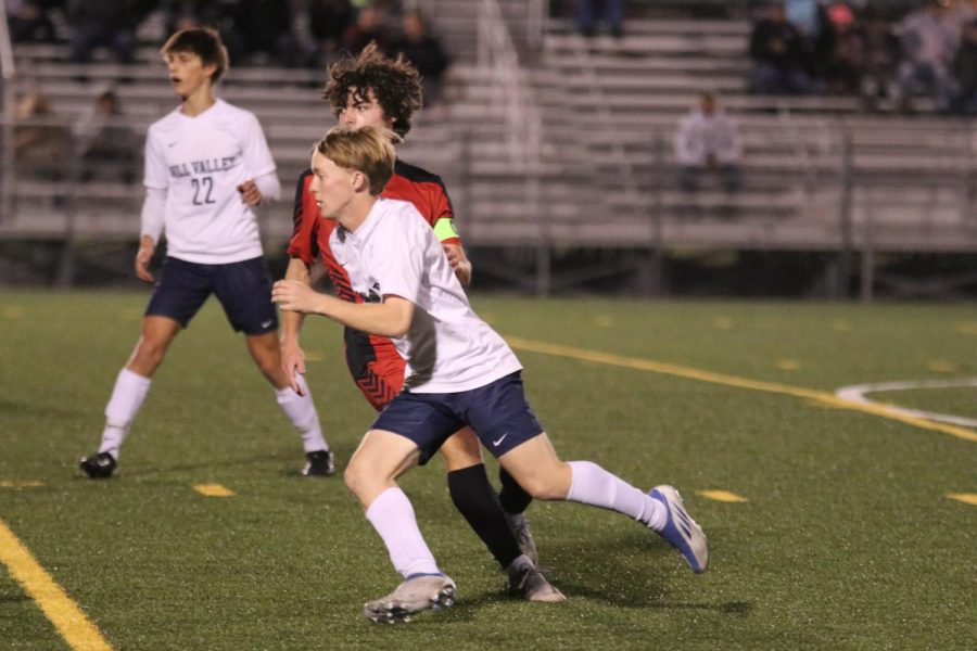 Senior Matt Morgan runs past his opponent to gain possession of the ball.