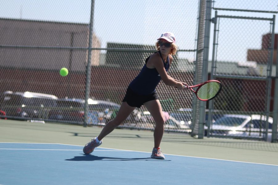 Reaching back, freshman Heidi Baillos gets ready to swing.