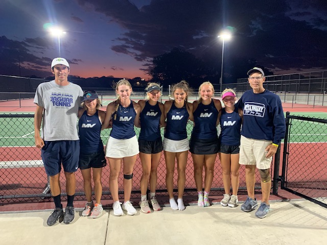 Tennis team gathers together after a hard fought State Championship tournament.