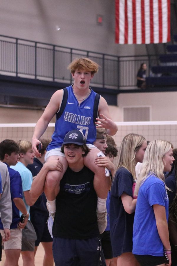 Perched on junior Ryan Devril’s shoulders, junior Austin Cline celebrates the win of the Jaguars. 