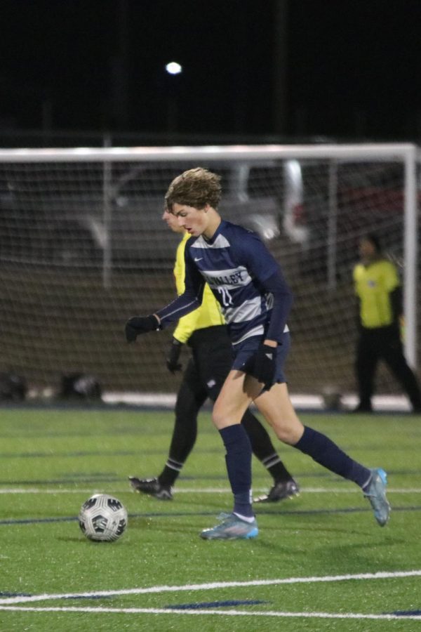 Sophomore Nic Schrag prepares to pass the ball up the field.