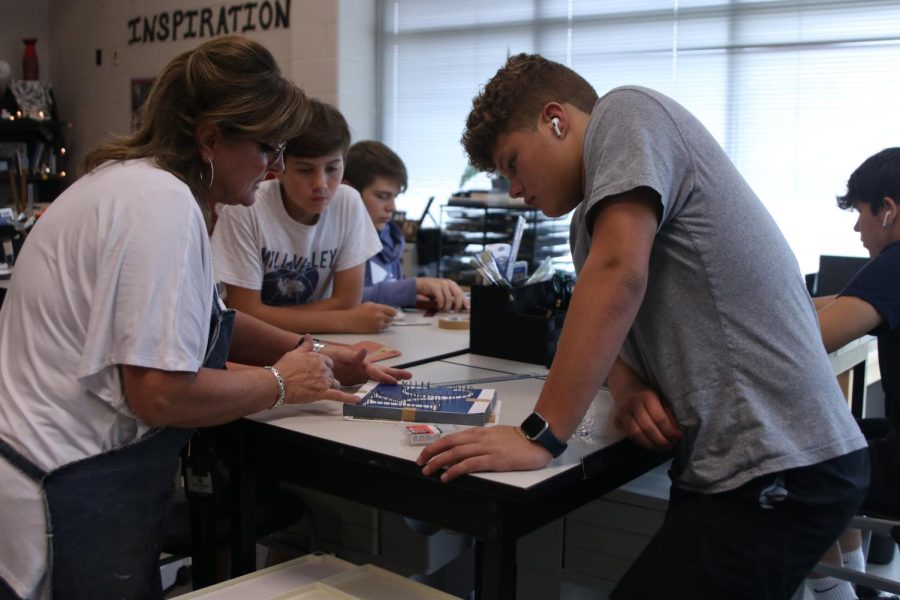 Junior Austin Leiker looks to Jodie Ellis while she explains instructions Sept. 16 in Jodie Ellis’s survey of fine crafts class.