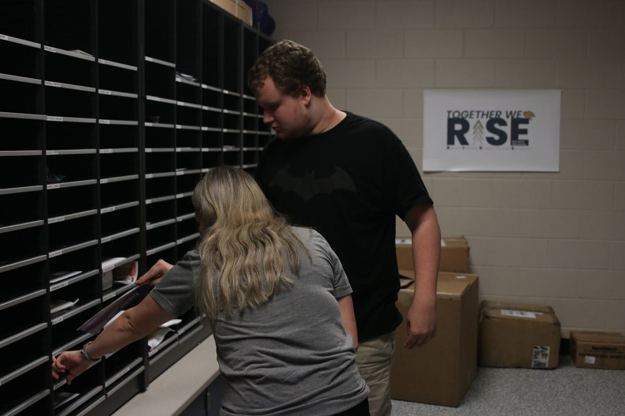 In the office  Wednesday, Oct. 5, junior Gus Gosch delivers mail to teachers with help from paraprofessional Kaila Masters. 