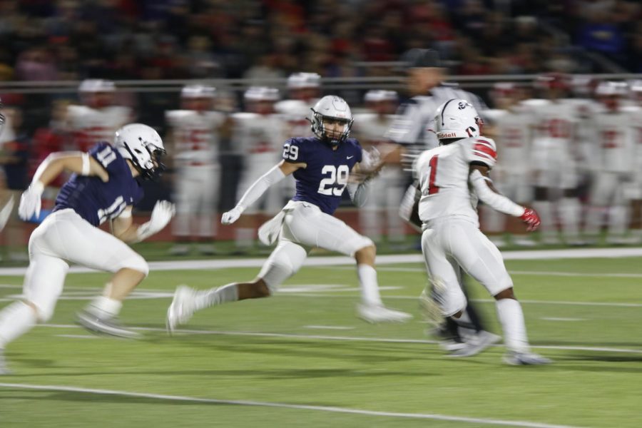 Senior Dylan Massey chases down the Olathe North running back. 
