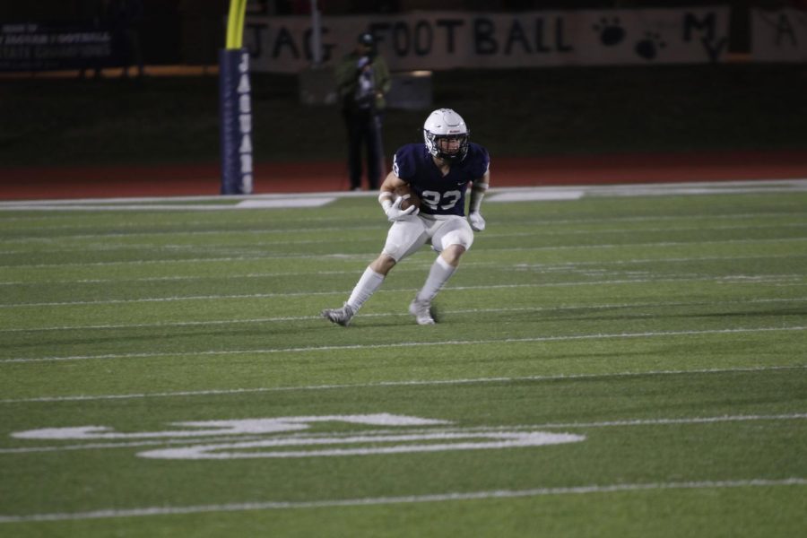 Returning the punt, senior Holden Zigmant begins his advance down the field.