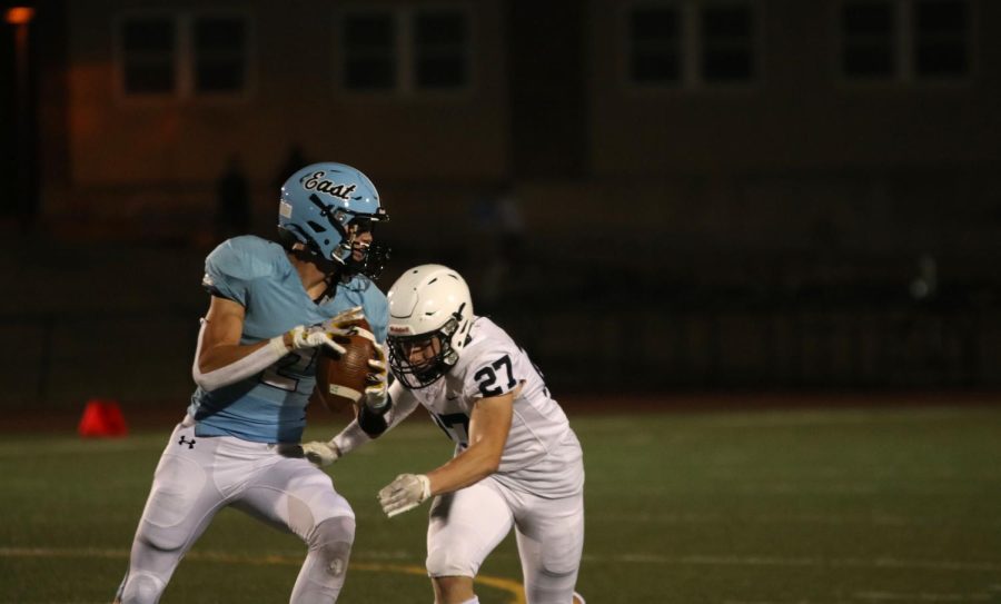 Going in for the tackle, junior Garrett Cronin sacks the opposing team’s quarterback.