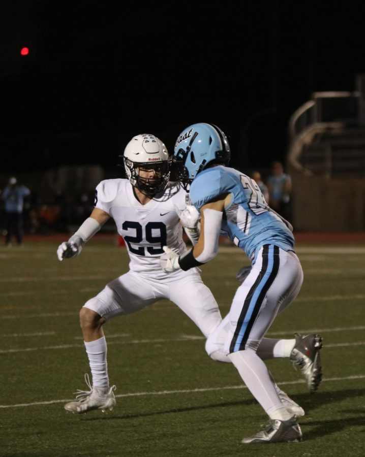 Going in for the tackle, junior Garrett Cronin sacks the opposing team’s quarterback.
