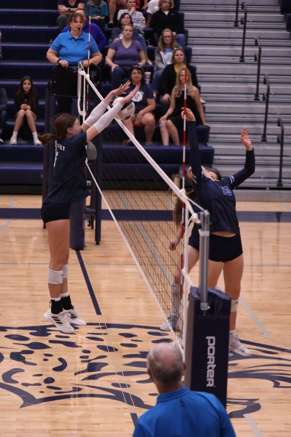 Hands up, sophomore Saida Jacobs blocks a tip from the opposing middle hitter. 