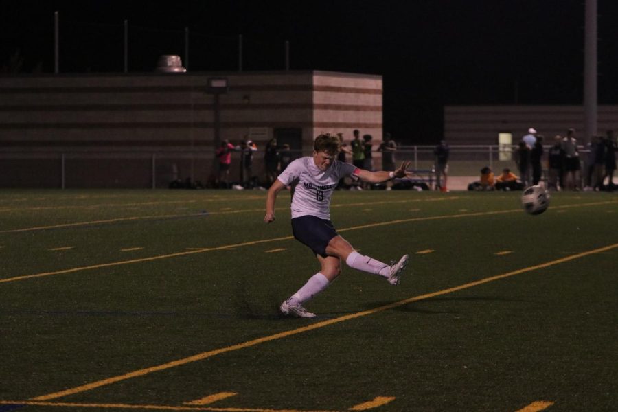 Senior Owen Peachee initiates kickoff for the second half of the game.