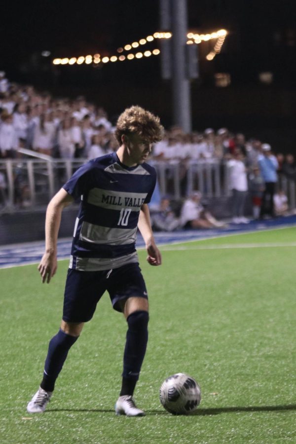 From the corner, senior Nico Pendleton looks up for an open pass.