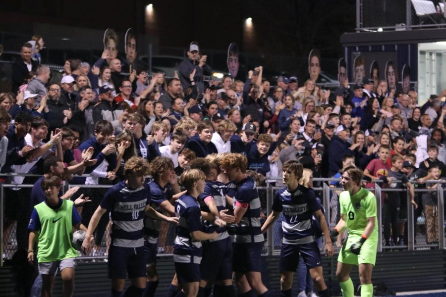 After scoring the second goal, the team celebrates with the crowd.