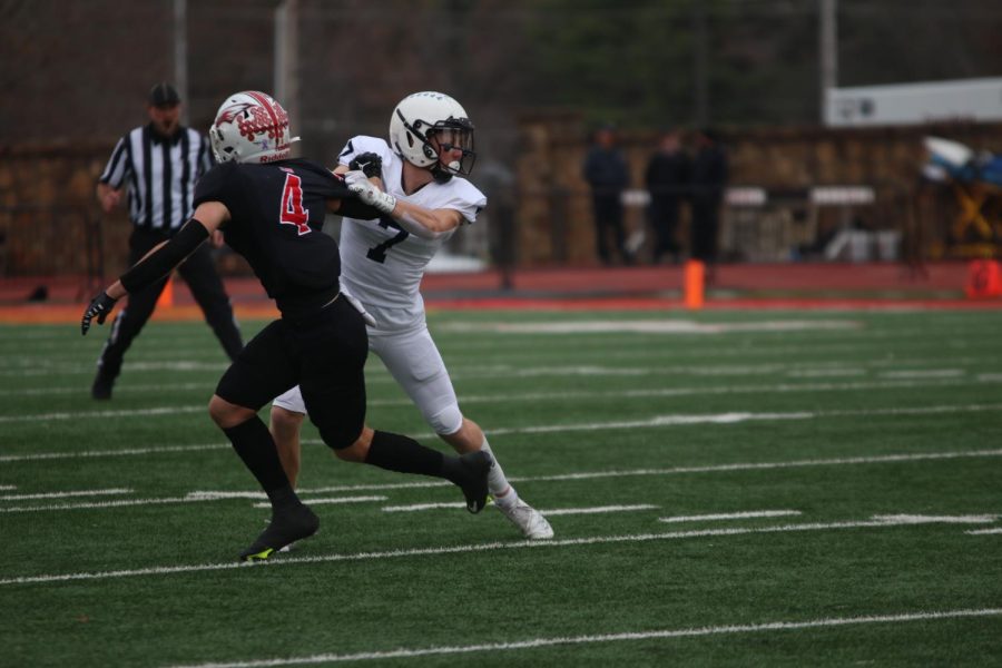 Senior Mikey Bergeron grabs a hold of the opponents jersey.