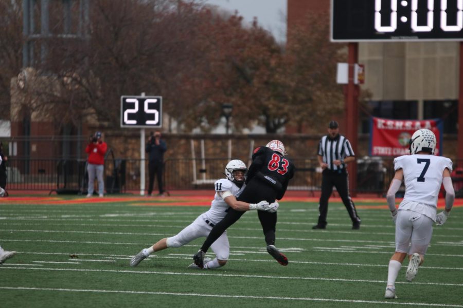 Senior Mark Bauer takes down his opponent with the ball, ending the play.