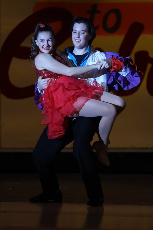 With a smile on her face, sophomore Allyson Makalous is spun around by freshman Barron Fox during their dance.