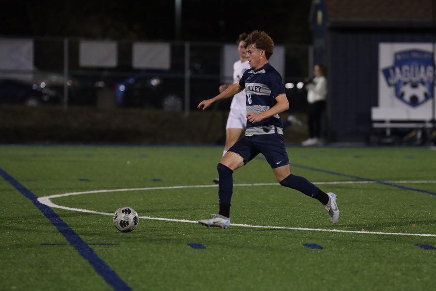 Just past mid field, senior Nico Pendleton takes the ball down the field. 
