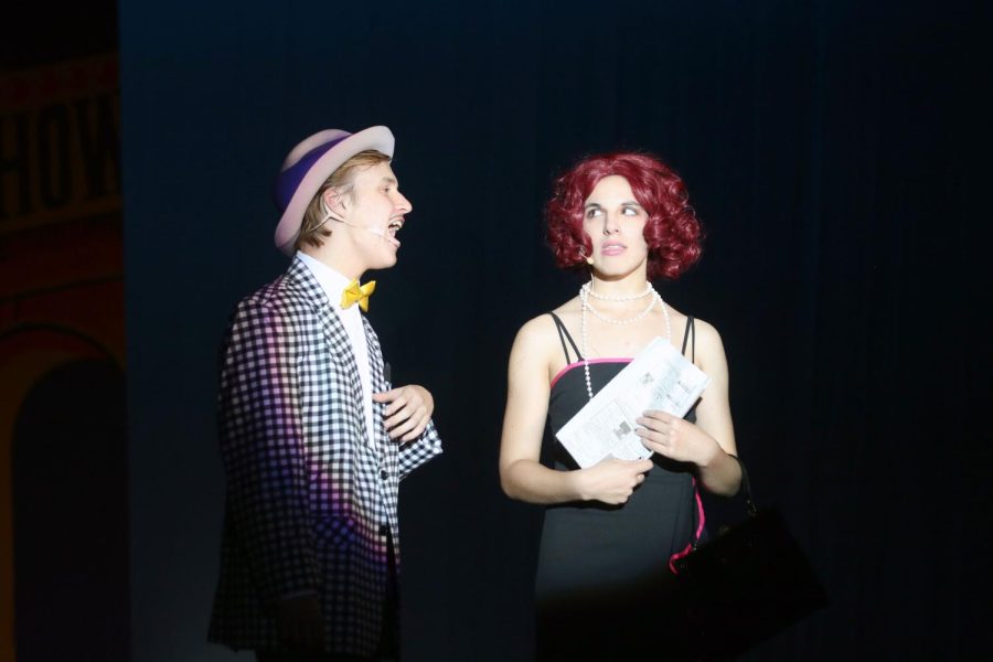 Seniors Briana Bruno and Carter Harvey sing “Sue me” while playing as Adelaide and Nathan Detroit.