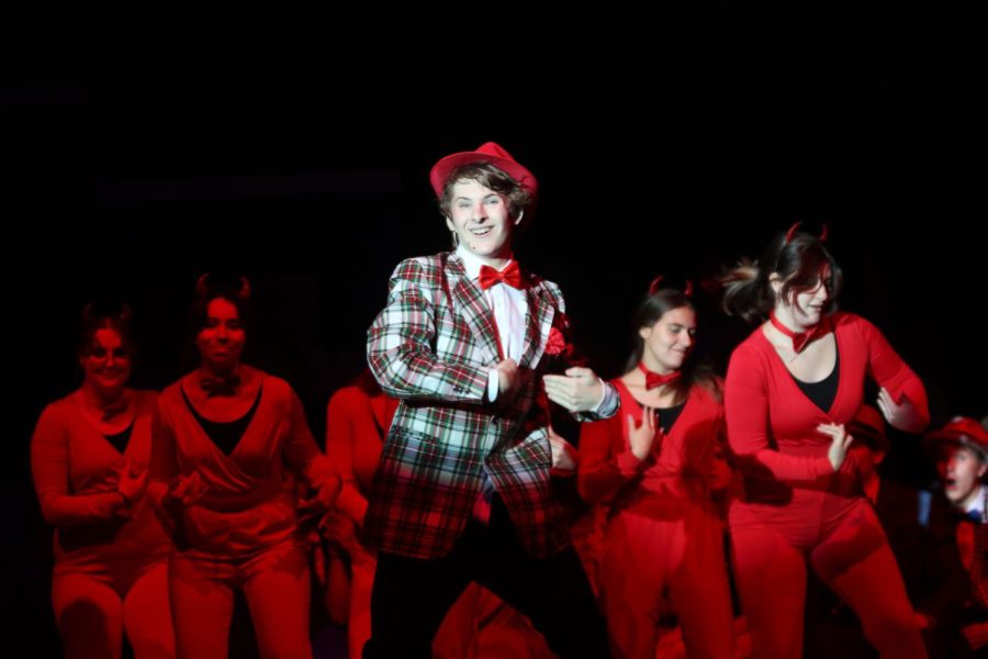 While playing the character Nicely Nicely Johnson, sophomore Ayden Brown dances and sings during “Don’t Rock the Boat”.