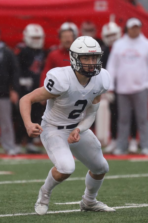 Senior Hayden Jay runs around the opposing teams defensive line.