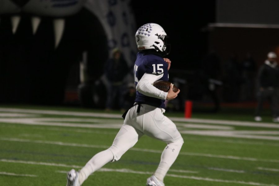 Junior Daniel Blaine runs down the field with the ball.