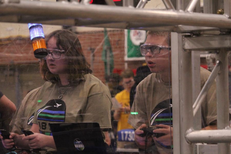 Concentrating on the robot, Mill Valley senior Kate Hereth and DeSoto junior Bobby Remillard drive at CowTown Throwdown.