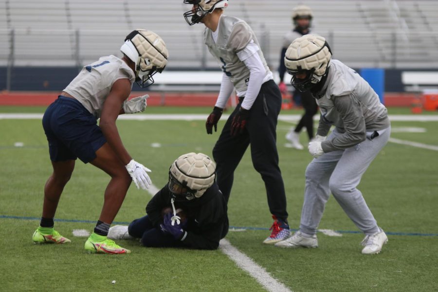 A defensive player recovers an on-side kick during Thursday Nov. 17 practice.  