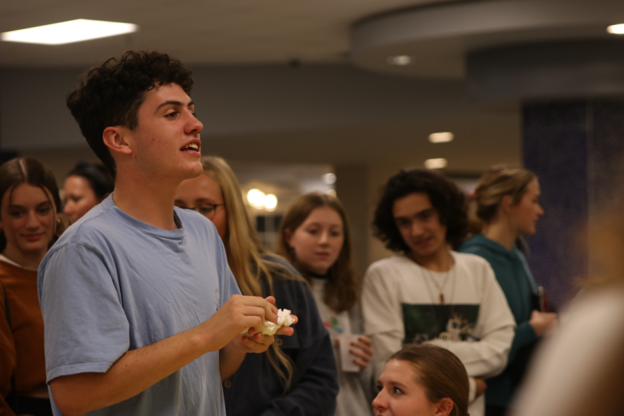 After competing in the pie-eating contest, senior Zack Kellog cleans off his hands 