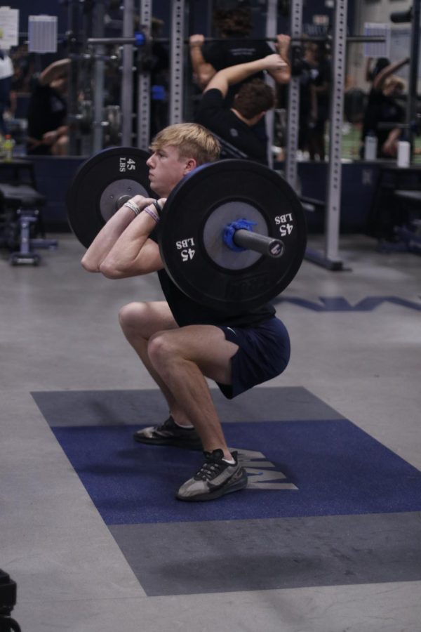 Hang-cleaning during zero hour, senior Hudson Ivey reps out 135 pounds.
