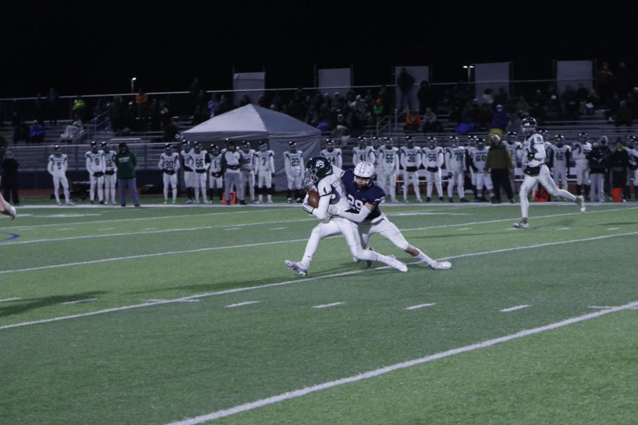 Senior Dylan Massey makes a tackle on an opposing player.