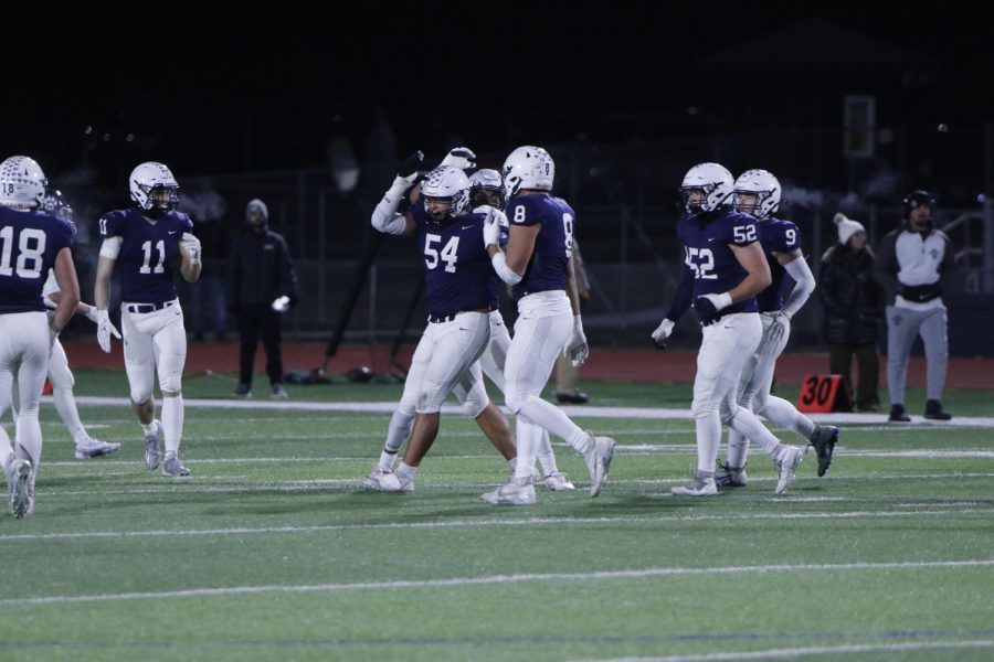 Celebrating a sack, senior Grant Rutkowski throws up the land shark.