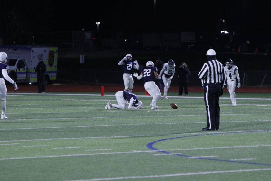 Upset after a dropped possible interception, junior Lincoln Gray falls to the turf.