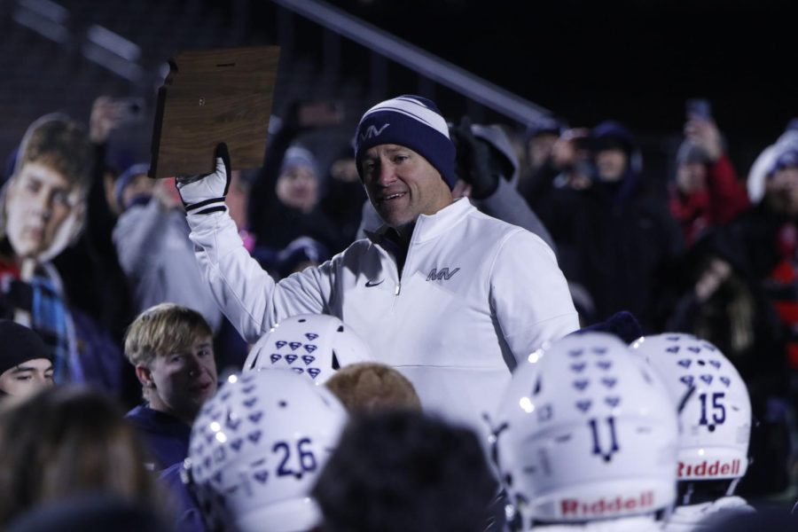 Holding up the Sub-State Champion trophy, coach Joel Applebee gives a post-game speech about the teams effort throughout the season.