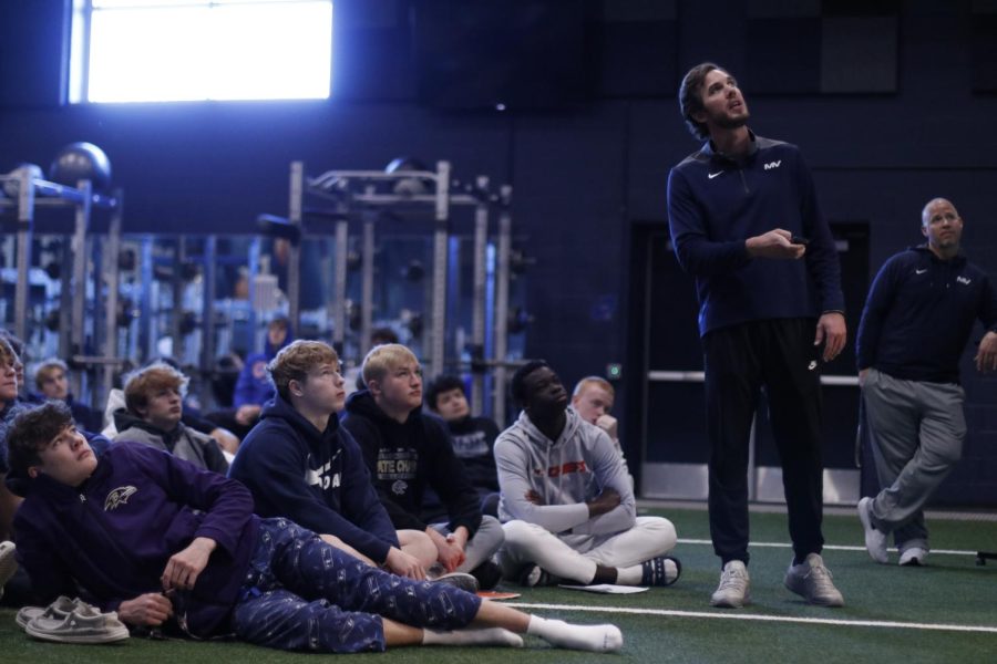 Talking about film, coach Reice Petty reviews special teams footage.