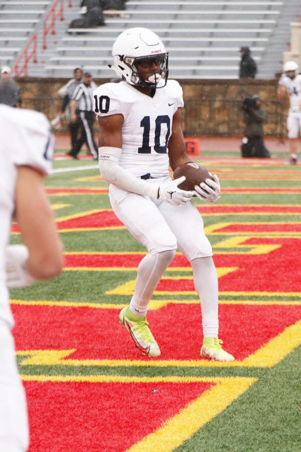 Slowing himself down in the end zone, junior Davion Harris secures his second touchdown of the game.