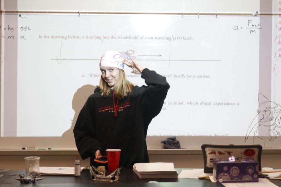 Standing in front of Mr. Browns class, junior Sam Mullen presents her project by telling which part of the brain she used to ask Mr. Brown a question