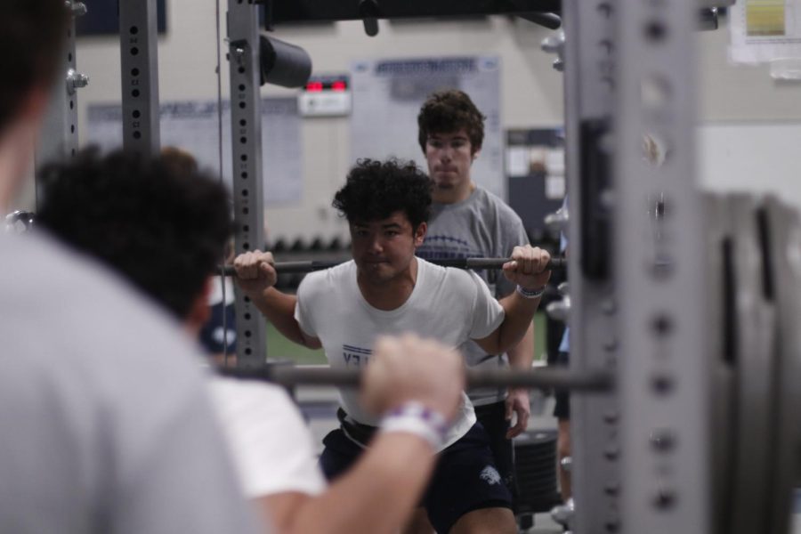 Squatting+335+pounds+on+his+shoulders+during+the+Zero+Hour+lift+period%2C+junior+Truman+Griffith+progresses+through+his+early+morning+strength+training+workout+Monday%2C+Nov.+14.