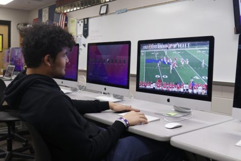 Junior Truman Griffith reviews game film from a previous opponent during seminar Monday, Nov. 14.