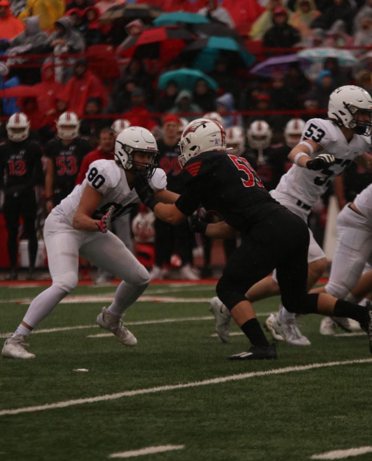 Sophomore Brody Brigham blocks the opponent. 