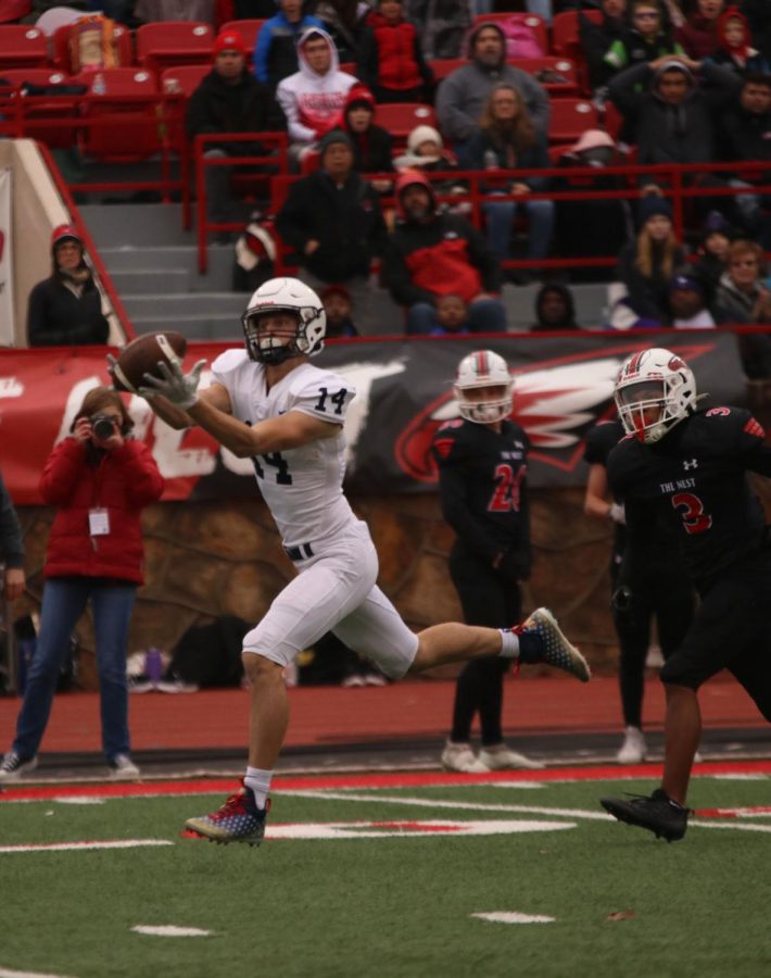 Senior Preston Oliver reaches for the catch in the second half. 