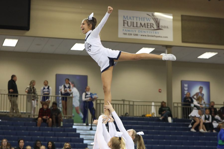 Looking to the side, freshman Jada Winfrey does an arabesque.
