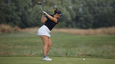 Driver in hand, junior Kathryn Yockey takes a practice swing before teeing off. Golf competed at the 6A state competition Tuesday, Oct 18.