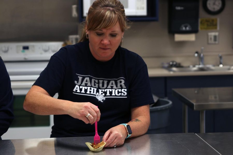 FACS teacher Margaret Dieckhoff digs into the first testing of the pecan pie