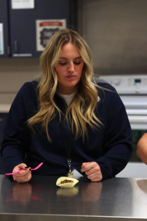 FACS teacher Lauren Stringer tastes the pecan pie for the first time