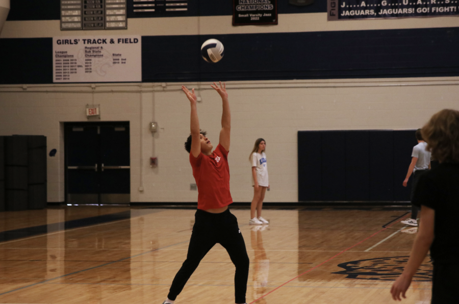 Senior Parker Schwartz hits the ball up over the net in his Team Sports class Tuesday, Nov. 15.