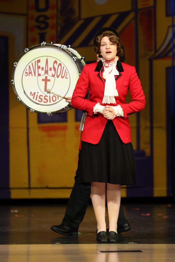 At the beginning of the show, junior Caroline Alley sings at the front of the stage. 