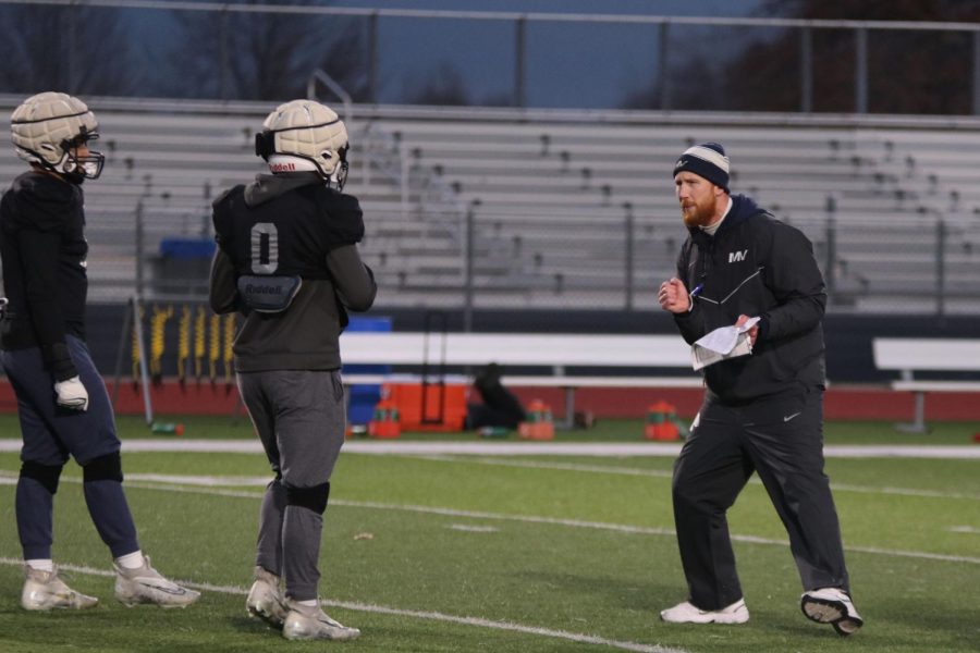 Coach Andrew Hudgins explains what to do to the defense during Tuesday, Nov. 15 practice. 